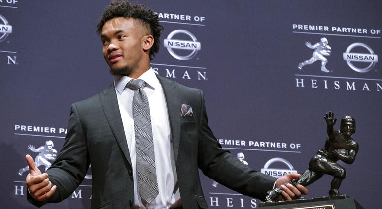 Oklahoma quarterback Kyler Murray holds the Hesiman Trophy after winning the award in New York AP DO NOT USE