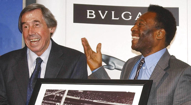 In this Thursday March 4, 2004 file photo Brazilian soccer legend Pele, right, presents former England goalkeeper Gordon Banks with a photograph showing Banks saving a header from Pele in the 1970 World Cup, at a press conference in London, to mark FIFA' DO NOT USE