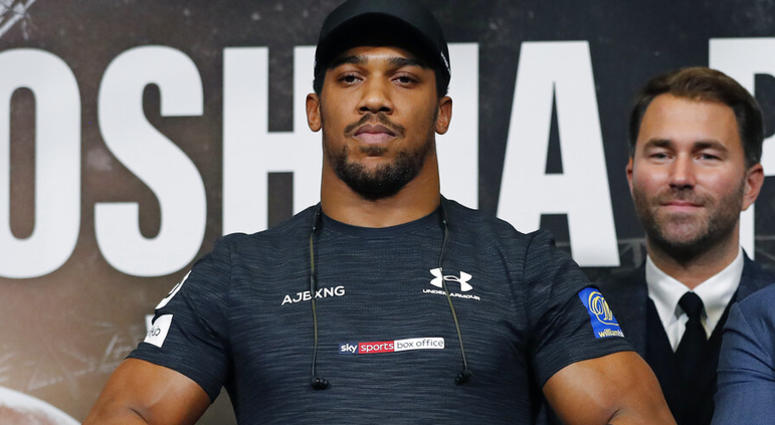 boxer Anthony Joshua, of Britain, foreground, poses with boxing promoter Eddie Hearn after a press conference for Joshua's fight against Russia's Alexander Povetkin AP DO NOT USE