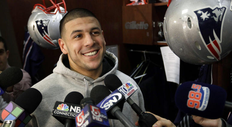 New England Patriots tight end Aaron Hernandez speaks to reporters at his locker at the NFL football stadium in Foxborough, Mass. AP DO NOT USE
