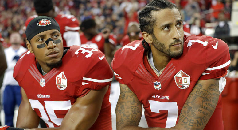 San Francisco 49ers safety Eric Reid (35) and quarterback Colin Kaepernick (7) kneel during the national anthem before an NFL football game AP DO NOT USE