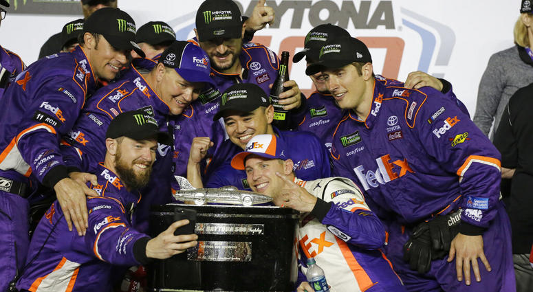 Denny Hamlin, center front, poses for a photo with his crew members after winning the NASCAR Daytona 500 auto race at Daytona International Speedway, Sunday, Feb. 17, 2019, in Daytona Beach, Fla Denny Hamlin, center front, poses for a photo with his crew members after winning the NASCAR Daytona 500 auto race at Daytona International Speedway, Sunday, Feb. 17, 2019, in Daytona Beach, Fla