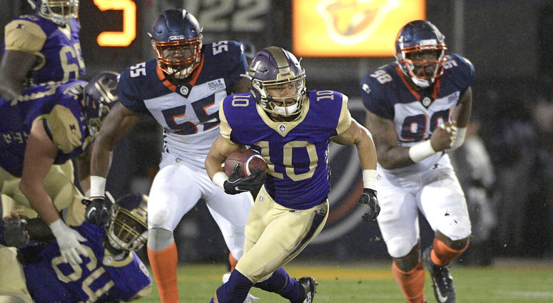 Atlanta Legends receiver Justin Thomas (10) runs with a reception in front of Orlando Apollos linebacker Andrew Ankrah (55) and defensive end Anthony Moten Jr. (98) during the second half of an Alliance of American Football game Atlanta Legends receiver Justin Thomas (10) runs with a reception in front of Orlando Apollos linebacker Andrew Ankrah (55) and defensive end Anthony Moten Jr. (98) during the second half of an Alliance of American Football game