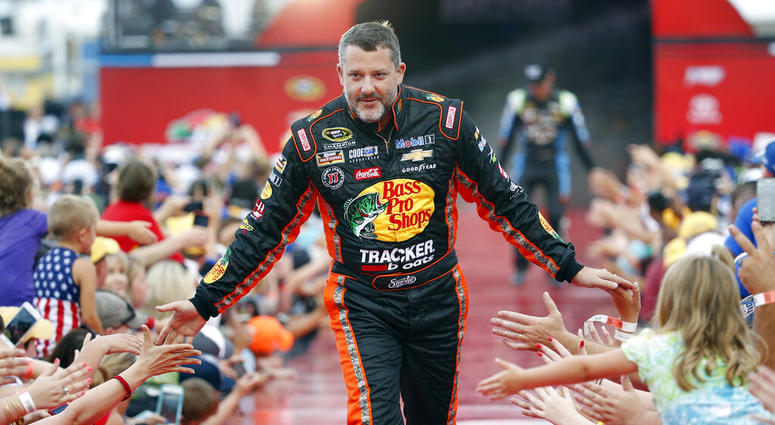 Tony Stewart is greeted by fans during driver introductions before the start of the NASCAR Sprint Cup auto race at Daytona International Speedway in Daytona Beach, Fla. Tony Stewart is greeted by fans during driver introductions before the start of the NASCAR Sprint Cup auto race at Daytona International Speedway in Daytona Beach, Fla.