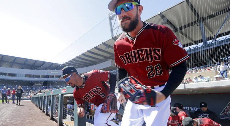 Arizona Diamondbacks' Steven Souza Jr. (28) and Eduardo Escobar (5) lead players out of the dugout before a spring training baseball game against the San Francisco Giants Thursday, March 14, 2019, in Scottsdale, Ariz. AP DO NOT USE