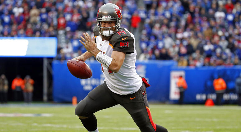 In this Nov. 18, 2018, file photo, Tampa Bay Buccaneers quarterback Ryan Fitzpatrick (14) rushes for a touchdown against the New York Giants during an NFL football game in East Rutherford, N.J. AP DO NOT USE