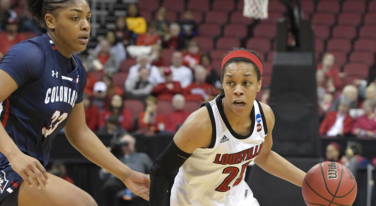 Louisville guard Asia Durr (25) drives past the defense of Robert Morris center Nneka Ezeigbo (33) during the second half of a first-round game in the NCAA women's college basketball tournament in Louisville, Ky., Friday, March 22, 2019 AP DO NOT USE