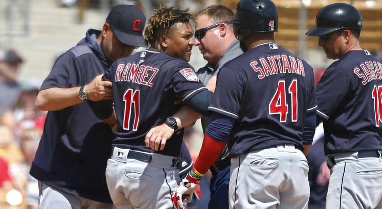Cleveland Indians' Jose Ramirez (11) is helped to his feet after an injury during the third inning of the team's spring training baseball game against the Chicago White Sox on Sunday, March 24, 2019, in Glendale, Ariz. AP DO NOT USE