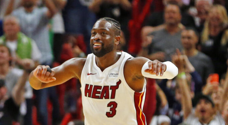 Miami Heat guard Dwyane Wade (3) runs up the court to celebrate the win against the Dallas Mavericks at an NBA basketball game, Thursday, March 28, 2019, in Miami. A P DO NOT U S E