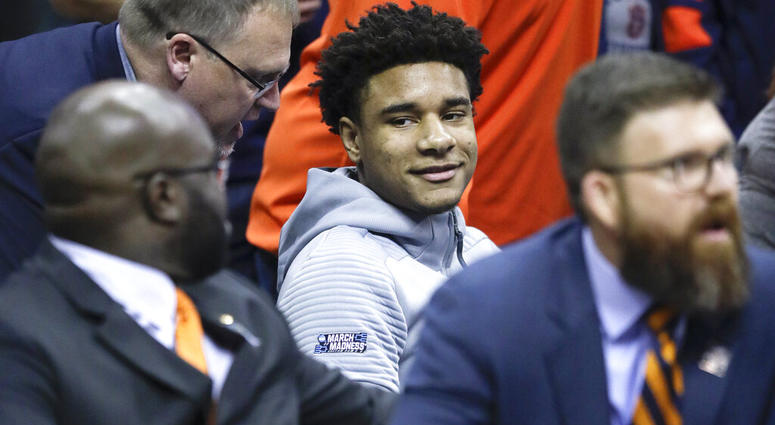 Injured Auburn forward Chuma Okeke is positioned behind the Auburn bench in a wheelchair during the second half of the Midwest Regional final game against Kentucky AP DO NOT USE