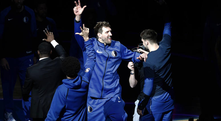 Dallas Mavericks' Dirk Nowitzki (41) is introduced for the team's NBA basketball game against the Phoenix Suns in Dallas, Tuesday, April 9, 2019. AP DO NOT USE