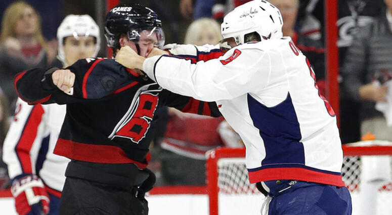 Washington Capitals' Alex Ovechkin, right, of Russia, punches Carolina Hurricanes' Andrei Svechnikov, also of Russia, during the first period of Game 3 of an NHL hockey first-round playoff series in Raleigh, N.C., Monday, April 15, 2019. AP DO NOT USE