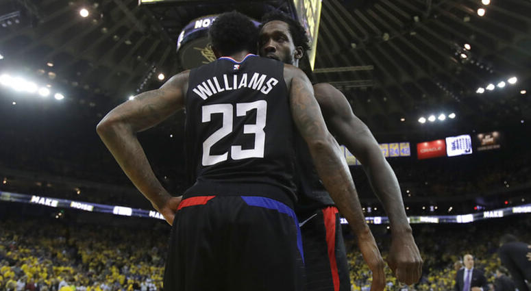 Los Angeles Clippers guard Lou Williams (23) celebrates with Patrick Beverley during the second half of Game 2 of a first-round NBA basketball playoff series against the Golden State Warriors in Oakland, Calif., Monday, April 15, 2019. AP DO NOT USE