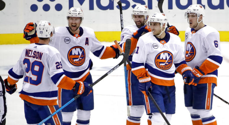 New York Islanders' Josh Bailey (12) celebrates his empty-net goal against the Pittsburgh Penguins during the third period in Game 4 of an NHL hockey first-round playoff series in Pittsburgh, Tuesday, April 16, 2019. AP DO NOT USE