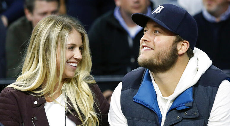 In this Nov. 17, 2015, file photo, Detroit Lions quarterback Matthew Stafford, right, smiles while watching the Detroit Pistons play the Cleveland Cavaliers with his wife Kelly, left, during the first half of an NBA basketball game, in Auburn Hills, Mich. AP DO NOT USE