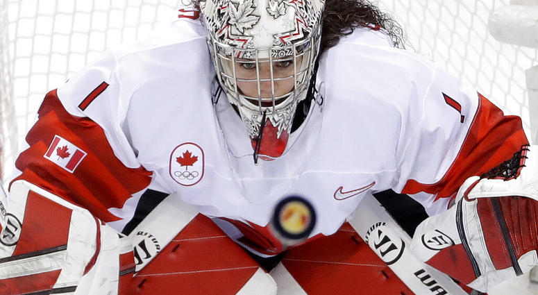 file photo, goalie Shannon Szabados (1), of Canada, stares at the flying puck during the second period of the women's gold medal hockey game against the United States at the 2018 Winter Olympics AP DO NOT USE