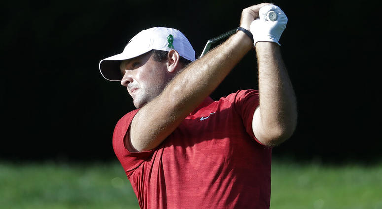 Patrick Reed wears a green ribbon on his hat in support of the victims of the University of North Carolina-Charlotte shooting AP DO NOT USE
