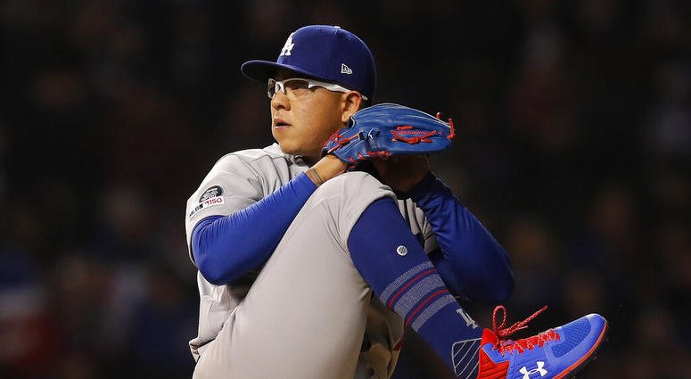 file photo, Los Angeles Dodgers' Julio Urias pitches against the Chicago Cubs during the first inning of a baseball game in Chicago. Los Angeles police say Urias was arrested Monday evening, May 13, 2019, for investigation of misdemeanor domestic battery