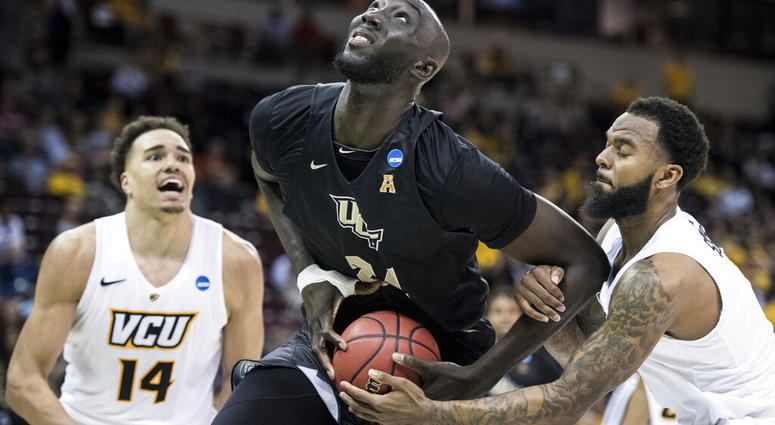 n this March 22, 2019 file photo, Central Florida center Tacko Fall (24) is fouled by VCU AP DO NOT USE