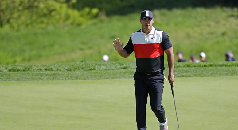 Brooks Koepka reacts after sinking a putt on the 14th green during the first round of the PGA Championship golf tournament, Thursday, May 16, 2019, at Bethpage Black in Farmingdale, N.Y. AP DO NOT USE