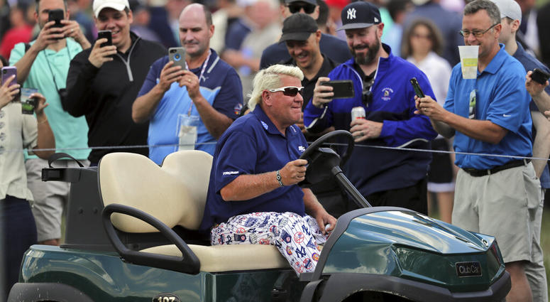 John Daly drives to the 10th tee in a golf cart during the first round of the PGA Championship golf tournament, Thursday, May 16, 2019, at Bethpage Black in Farmingdale, N.Y. John Daly drives to the 10th tee in a golf cart during the first round of the PGA Championship golf tournament, Thursday, May 16, 2019, at Bethpage Black in Farmingdale, N.Y.