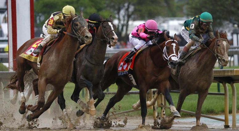 In this May 4, 2019, file photo, from left, Country House, ridden by Flavien Prat; War of Will, ridden by Tyler Gaffalione; Maximum Security, ridden by Luis Saez; and Code of Honor, ridden by John Velazquez; head down the mainstretch during the 145th runn AP DO NOT USE