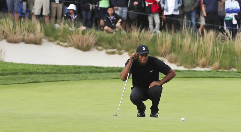 Tiger Woods lines up a putt on the 17th green during the second round of the PGA Championship golf tournament, Friday, May 17, 2019, at Bethpage Black in Farmingdale, N.Y. Tiger Woods lines up a putt on the 17th green during the second round of the PGA Championship golf tournament, Friday, May 17, 2019, at Bethpage Black in Farmingdale, N.Y.