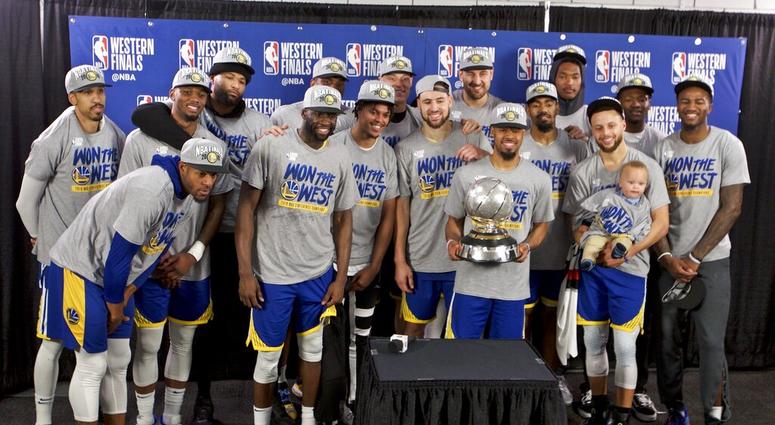 The Golden State Warriors players pose with the Western Conference Championship trophy The Golden State Warriors players pose with the Western Conference Championship trophy