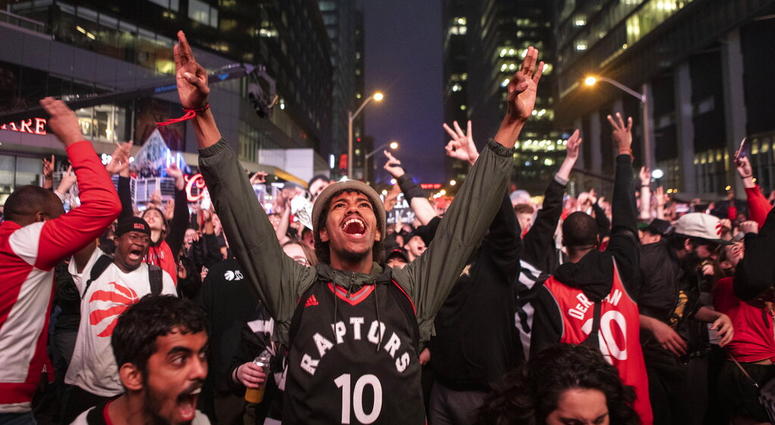 Toronto Raptors fans react as they watch Game 6 of the NBA basketball Eastern Conference finals between the Toronto Raptors and Milwaukee Bucks, on a screen outside Scotiabank Arena, in Toronto on Saturday, May 25, 2019. Toronto Raptors fans react as they watch Game 6 of the NBA basketball Eastern Conference finals between the Toronto Raptors and Milwaukee Bucks, on a screen outside Scotiabank Arena, in Toronto on Saturday, May 25, 2019.