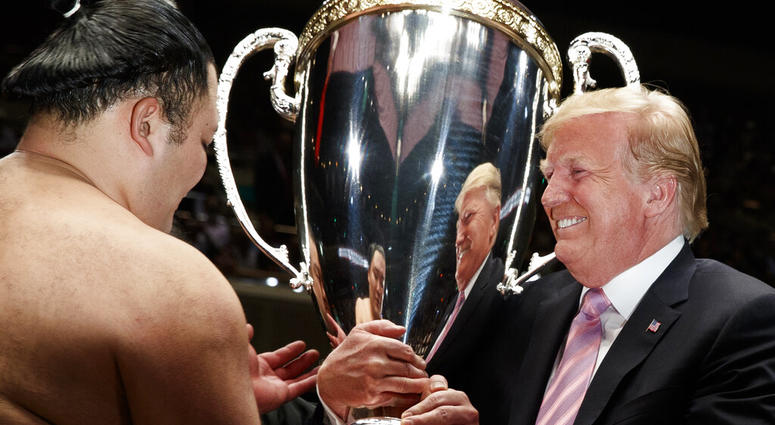 President Donald Trump presents the "President's Cup" to Tokyo Grand Sumo Tournament winner Asanoyama, at Ryogoku Kokugikan Stadium, Sunday, May 26, 2019, in Tokyo. President Donald Trump presents the "President's Cup" to Tokyo Grand Sumo Tournament winner Asanoyama, at Ryogoku Kokugikan Stadium, Sunday, May 26, 2019, in Tokyo.