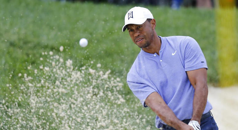Tiger Woods hits from the sand on the 13th hole during the first round of the Memorial golf tournament Thursday, May 30, 2019, in Dublin, Ohio. Tiger Woods hits from the sand on the 13th hole during the first round of the Memorial golf tournament Thursday, May 30, 2019, in Dublin, Ohio.