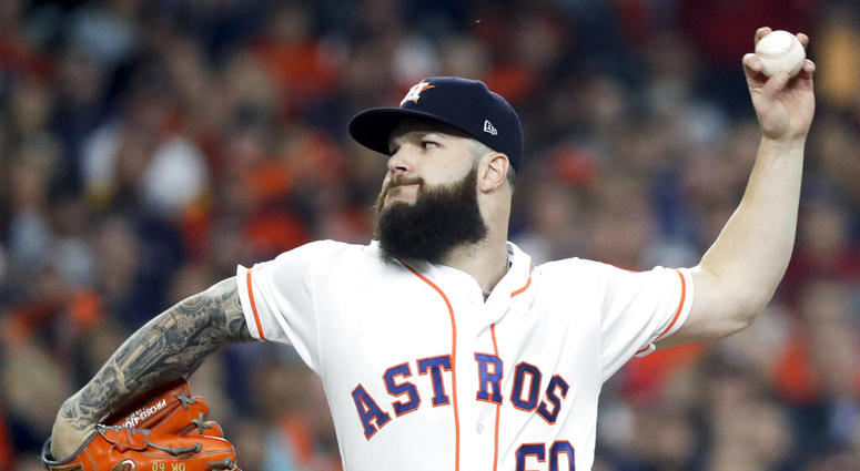 file photo, Houston Astros starting pitcher Dallas Keuchel throws against the Boston Red Sox
