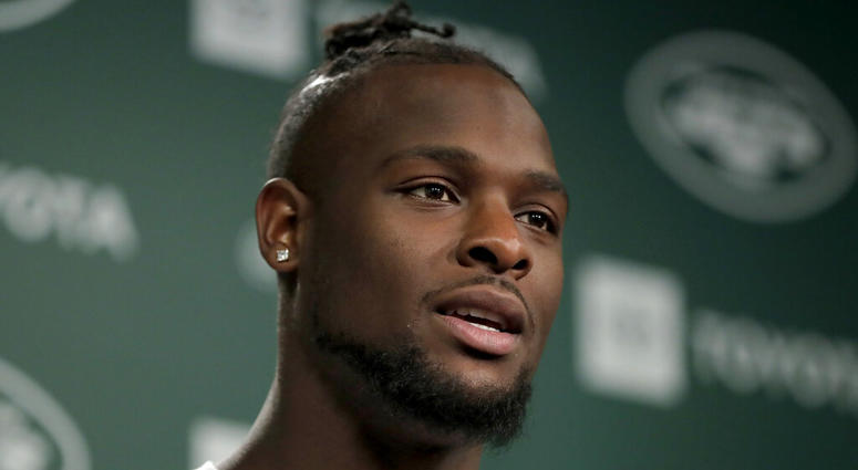 In this Tuesday, June 4, 2019, photo, New York Jets running back Le'Veon Bell speaks to reporters AP DO NOT USE