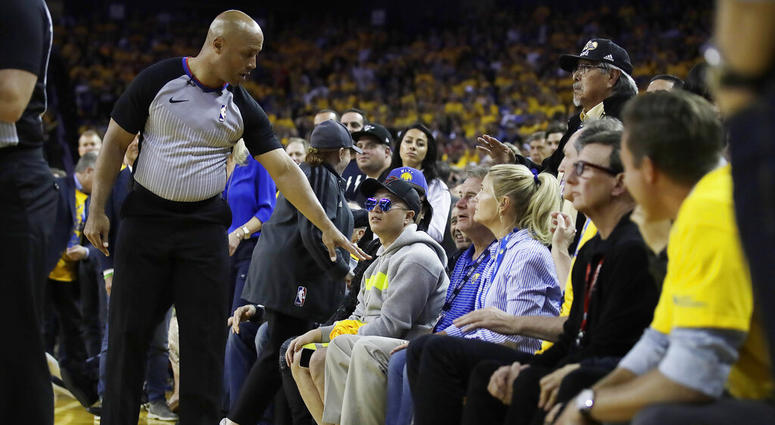 referee Marc Davis, left, gestures toward Golden State Warriors investor Mark Stevens referee Marc Davis, left, gestures toward Golden State Warriors investor Mark Stevens