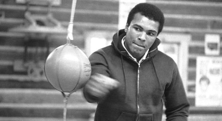 Muhammad Ali punches a bag in his Deer Lake, Pa., Muhammad Ali punches a bag in his Deer Lake, Pa.,