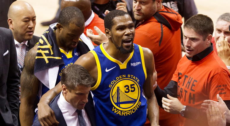 Golden State Warriors forward Kevin Durant (35) reacts as he leaves the court after sustaining an injury during first-half basketball action against the Toronto Raptors in Game 5 of the NBA Finals in Toronto, Monday, June 10, 2019. AP DO NOT USE