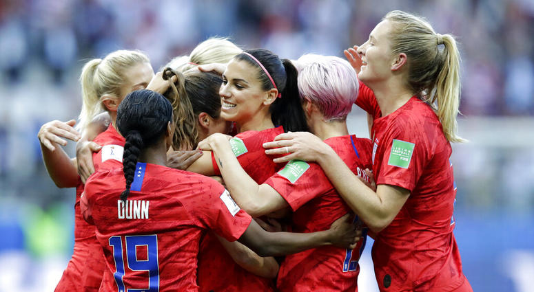 United States' Alex Morgan, center, celebrates after scoring the opening goal during the Women's World Cup Group F soccer match between United States and Thailand at the Stade Auguste-Delaune in Reims, France, Tuesday, June 11, 2019. AP DO NOT USE