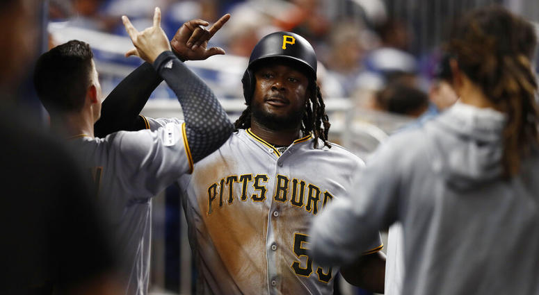 Pittsburgh Pirates' Josh Bell (55) celebrates in the dugout after scoring during the fifth inning of a baseball game against the Miami Marlins, Friday, June 14, 2019, in Miami. Pittsburgh Pirates' Josh Bell (55) celebrates in the dugout after scoring during the fifth inning of a baseball game against the Miami Marlins, Friday, June 14, 2019, in Miami.