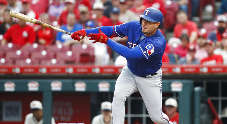 Texas Rangers' Asdrubal Cabrera hits an RBI single off Cincinnati Reds starting pitcher Tanner Roark during the first inning of a baseball game Saturday, June 15, 2019, in Cincinnati. Texas Rangers' Asdrubal Cabrera hits an RBI single off Cincinnati Reds starting pitcher Tanner Roark during the first inning of a baseball game Saturday, June 15, 2019, in Cincinnati.