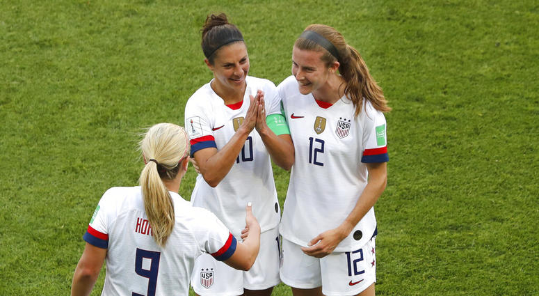 United States' Carli Lloyd , center, celebrates with Lindsey Horan and Tierna Davidson, right, after scoring the opening goal during the Women's World Cup Group F soccer match between the United States and Chile at the Parc des Princes in Paris, Sunday, J United States' Carli Lloyd , center, celebrates with Lindsey Horan and Tierna Davidson, right, after scoring the opening goal during the Women's World Cup Group F soccer match between the United States and Chile at the Parc des Princes in Paris, Sunday, J