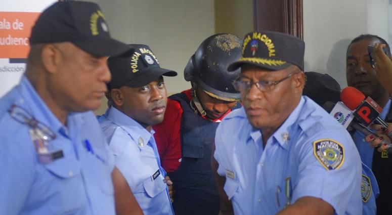 Gabriel Alexander Pérez Vizcaino, alias "Bone," behind wearing helmet, a suspect in the shooting of former Boston Red Sox slugger David Ortiz, is taken to court in Santo Domingo, Dominican Republic AP DO NOT USE