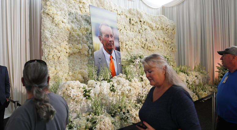Fans file past a wall of flowers with a portrait of Denver Broncos owner Pat Bowlen placed in the center during a memorial Tuesday Fans file past a wall of flowers with a portrait of Denver Broncos owner Pat Bowlen placed in the center during a memorial Tuesday