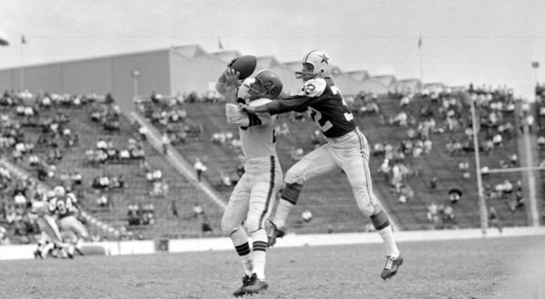 Oct. 16, 1960, file photo, Cleveland Browns' Ray Renfro (26), left, catches a pass before being tackled by Dallas Cowboys' Tom Franckhauser AP DO NOT USE
