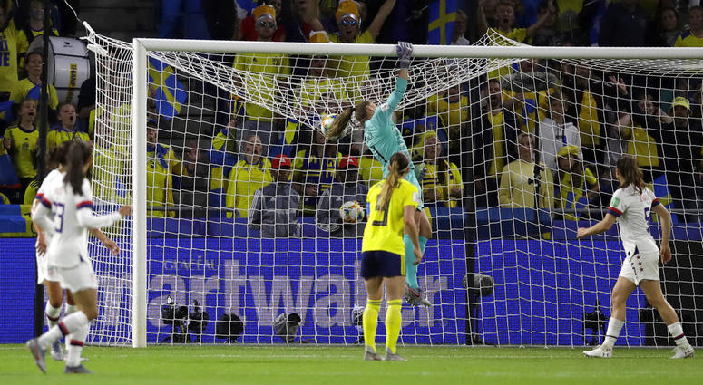 United States goalkeeper Alyssa Naeher punches the ball across the bar during the Women's World Cup Group F soccer match between Sweden and the United States at Stade Océane, in Le Havre, France, Thursday, June 20, 2019. United States goalkeeper Alyssa Naeher punches the ball across the bar during the Women's World Cup Group F soccer match between Sweden and the United States at Stade Océane, in Le Havre, France, Thursday, June 20, 2019.