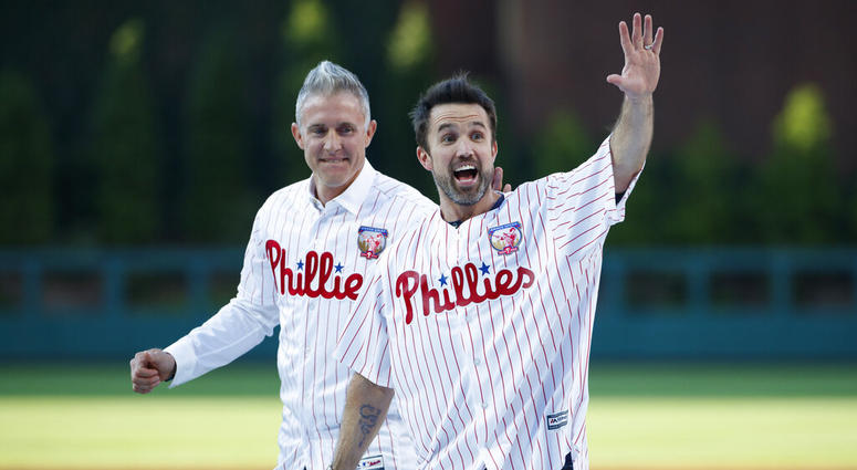 Actor Rob McElhenney, right, one of the creators of "It's Always Sunny in Philadelphia," reacts after catching a ceremonial first pitch from former Philadelphia Phillies player Chase Utley Actor Rob McElhenney, right, one of the creators of "It's Always Sunny in Philadelphia," reacts after catching a ceremonial first pitch from former Philadelphia Phillies player Chase Utley