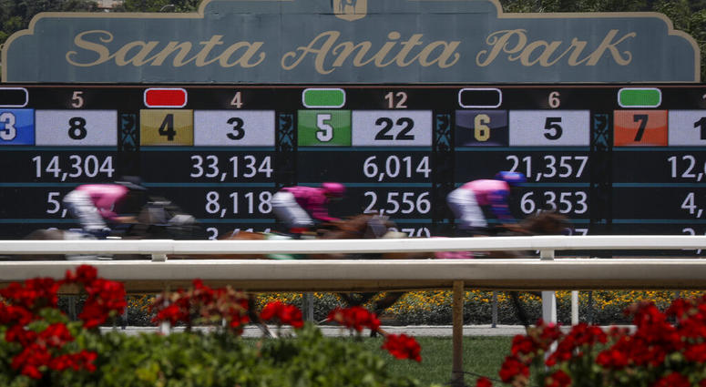 Horses finish the the first race during the last day of the winter/spring meet at the Santa Anita horse racing track Sunday, June 23, 2019, in Santa Anita, Calif. Horses finish the the first race during the last day of the winter/spring meet at the Santa Anita horse racing track Sunday, June 23, 2019, in Santa Anita, Calif.