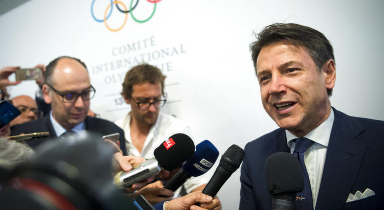 Italian Prime minister Giuseppe Conte speaks to journalists as he arrives during the first day of the 134th Session of the International Olympic Committee Italian Prime minister Giuseppe Conte speaks to journalists as he arrives during the first day of the 134th Session of the International Olympic Committee