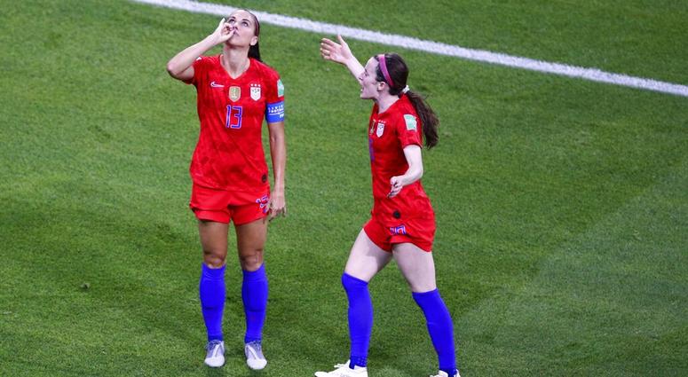 United States' Alex Morgan, left, celebrates her side's second goal during the Women's World Cup semifinal soccer match between England and the United States, at the Stade de Lyon outside Lyon, France, Tuesday, July 2, 2019.