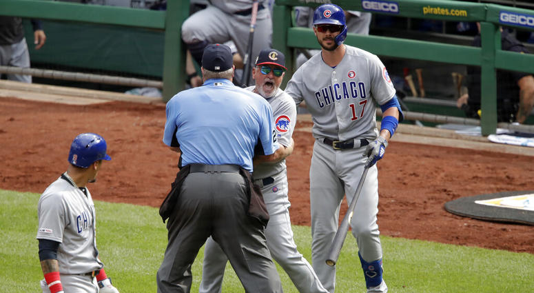 Chicago Cubs manager Joe Maddon, center, yells toward the Pittsburgh Pirates dugout as he is restrained by umpire Joe West and Cubs' Kris Bryant (17) during the fourth inning of a baseball game in Pittsburgh, Thursday, July 4, 2019. Maddon was ejected. Chicago Cubs manager Joe Maddon, center, yells toward the Pittsburgh Pirates dugout as he is restrained by umpire Joe West and Cubs' Kris Bryant (17) during the fourth inning of a baseball game in Pittsburgh, Thursday, July 4, 2019. Maddon was ejected.