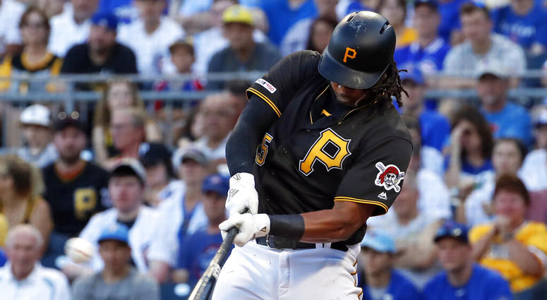 FILE - In this July 1, 2019, file photo, Pittsburgh Pirates' Josh Bell hits a three-run home run off Chicago Cubs starting pitcher Adbert Alzolay during the first inning of a baseball game in Pittsburgh.
